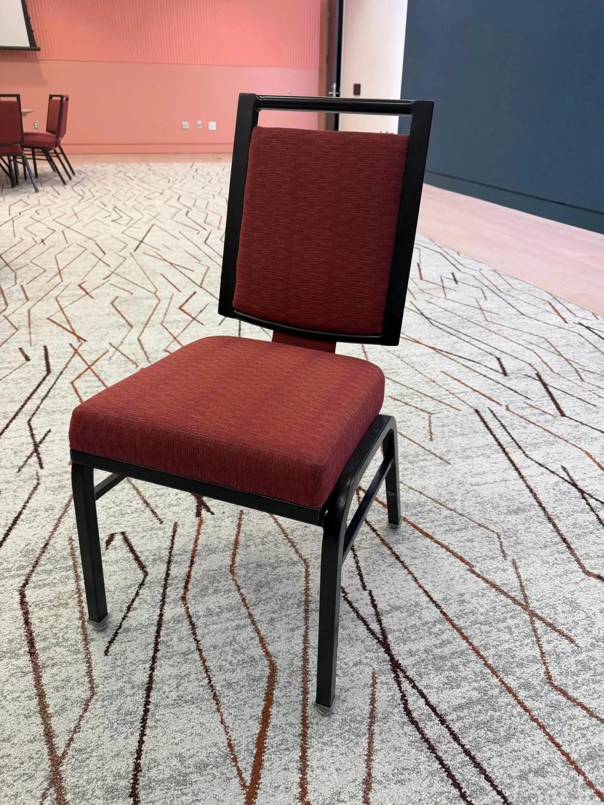 250 Banquet Chairs — Burgundy Padded Stacking, Black Frame (Gulfport, MS)